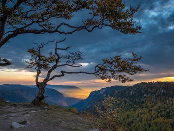 Scenic view of mountains against sky during sunset