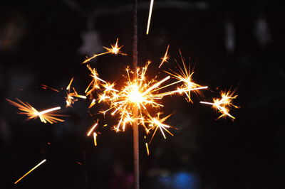 Close-up of firework display at night