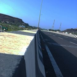 View of road against blue sky