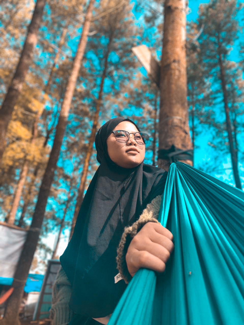 blue, tree, adult, one person, women, forest, spring, clothing, nature, smiling, happiness, young adult, plant, lifestyles, green, land, portrait, emotion, female, religion, outdoors, looking, standing, looking up, leisure activity, fashion, dress, traditional clothing, hijab, spirituality, autumn, woodland, cheerful, belief, photo shoot, day