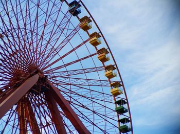 Low angle view of ferris wheel against sky