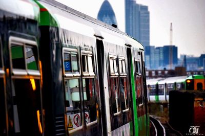 Close-up of train against sky in city