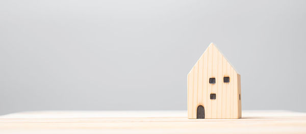 Close-up of toy on table against white background