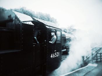 Train on railroad track against sky