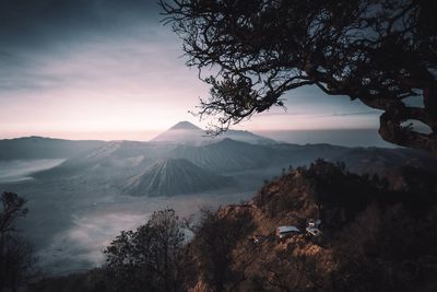 Scenic view of mountain against cloudy sky