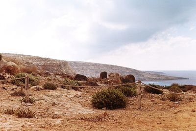 Scenic view of sea against cloudy sky