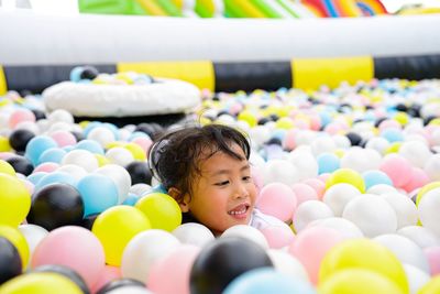 Portrait of cute girl with balloons