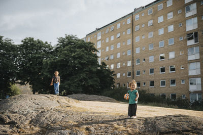 Sisters playing outdoors in residential area