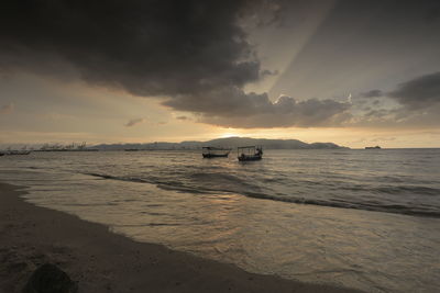 Scenic view of sea against sky at sunset