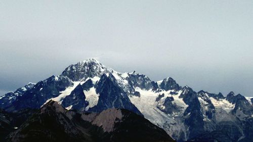 Scenic view of snow covered mountains