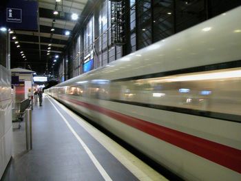 View of illuminated railroad station platform at night