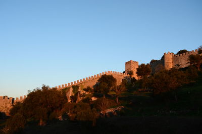 Low angle view of castle against blue sky