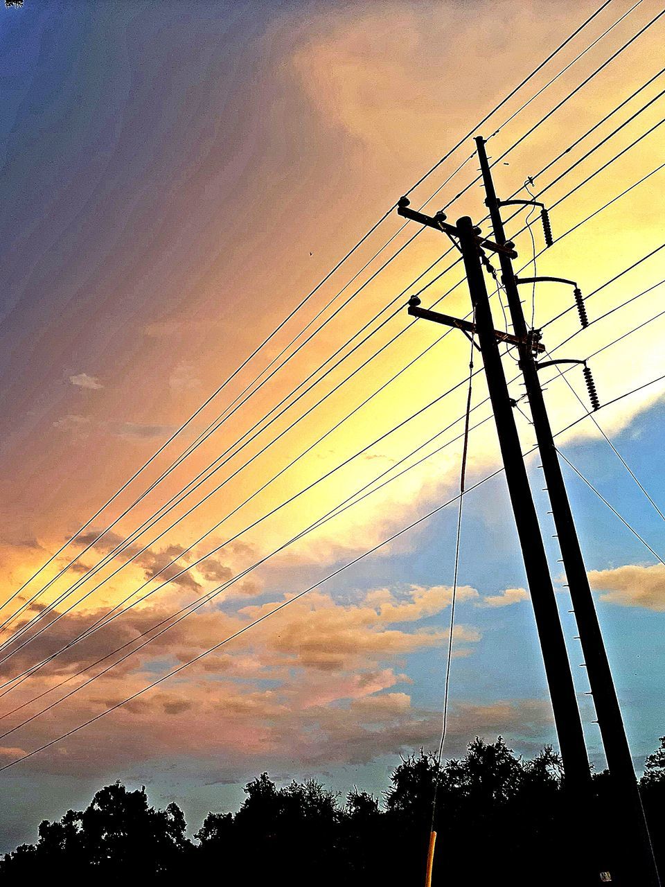 cable, electricity, sky, technology, sunset, electricity pylon, power supply, power line, power generation, silhouette, cloud, nature, low angle view, no people, afterglow, overhead power line, orange color, dusk, beauty in nature, outdoors, tree, scenics - nature, dramatic sky, plant, landscape, environment, transmission tower, architecture, line, sunlight, public utility, evening, communication, built structure