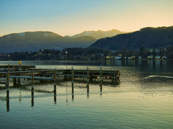 Scenic view of lake against sky during sunset