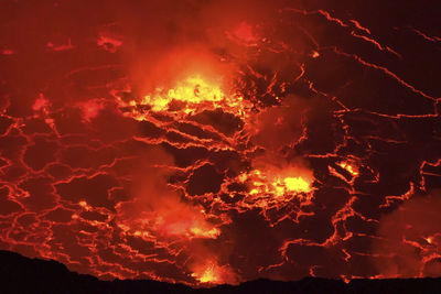 Close-up of fire against sky at night