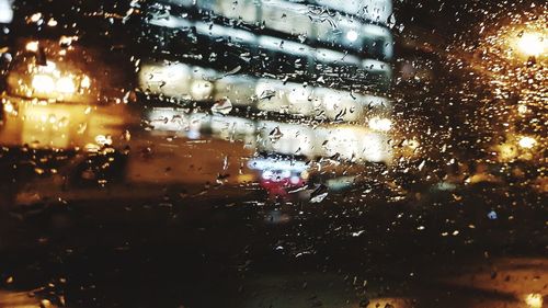 Raindrops on glass window during rainy season