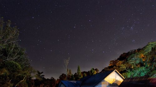 Low angle view of building against sky at night