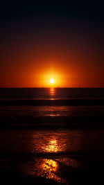 Scenic view of sea against romantic sky at sunset