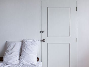 White wall with closed door