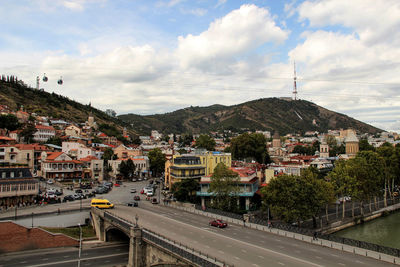 Road by city against sky