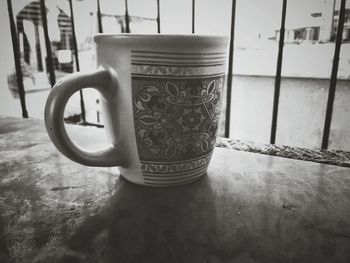 Close-up of coffee cup on table