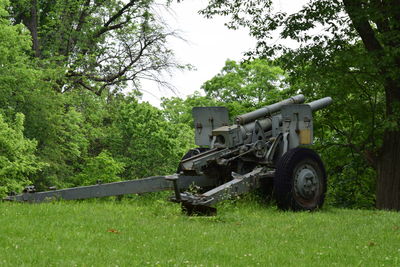 Tractor on field against sky