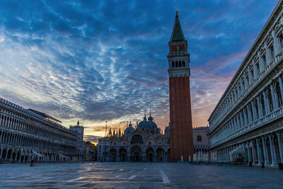 St. mark's square with campanile at sunrise in venice in italy