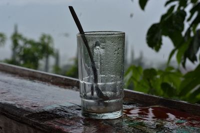 Close-up of wet glass on table