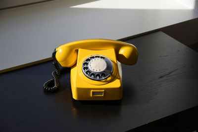 Close-up of telephone on table