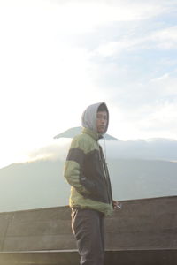 Man looking at sea against sky