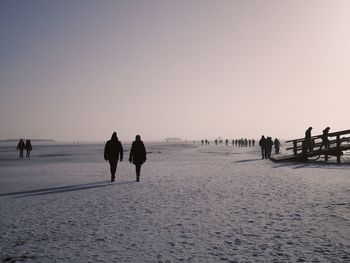 People on beach during winter