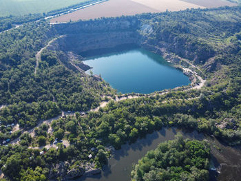 High angle view of lake amidst trees in forest