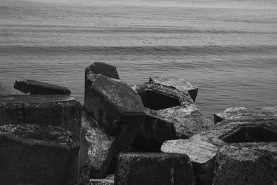 High angle view of rocks on sea shore