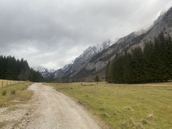 Road amidst landscape against sky