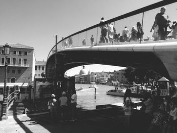 Bridge over river with city in background