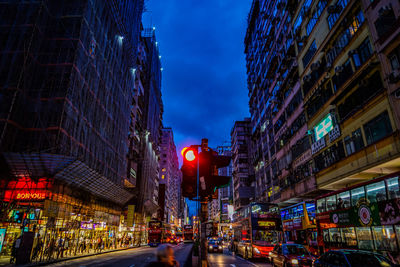 Illuminated city street at night