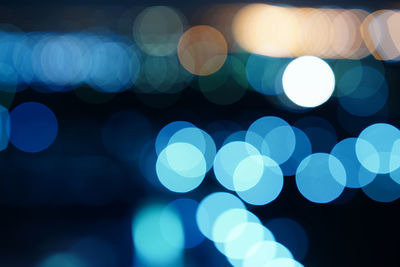 Defocused image of illuminated lights at night