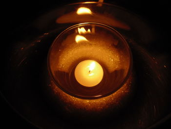 Close-up of lit tea light candle