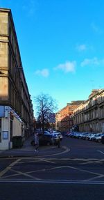 Road in city against sky