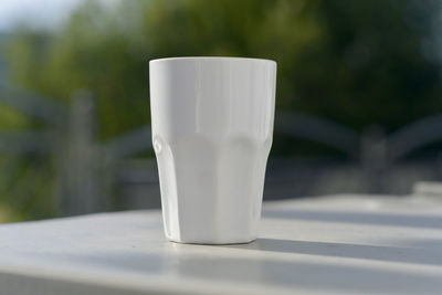 Close-up of coffee cup on table