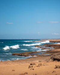 Scenic view of beach against sky