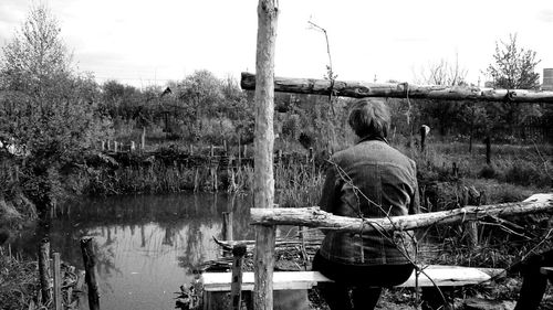 Person standing on tree trunk