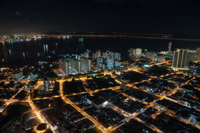 High angle view of illuminated buildings in city at night