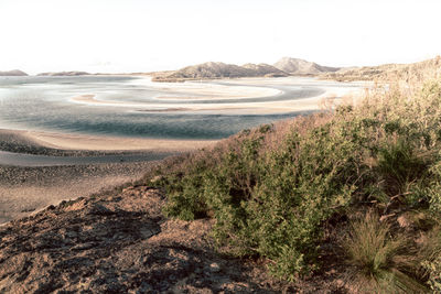 Scenic view of land against clear sky