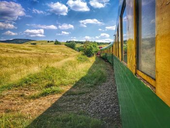 Panoramic view of train on land against sky