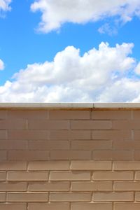 Low angle view of wall against sky