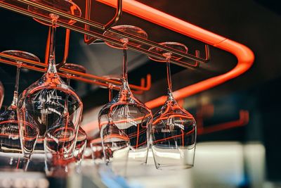 Close-up of wineglass hanging at bar