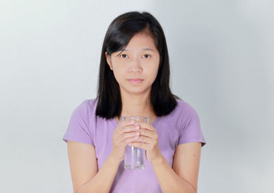 Portrait of a woman drinking glass