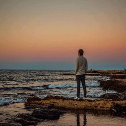 Scenic view of sea at sunset