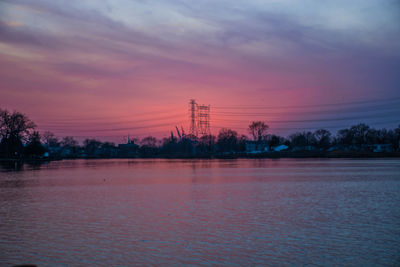 Scenic view of silhouette trees against sky at sunset